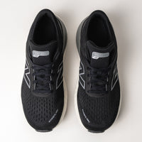 Top view of the New Balance 1540 V4, showcasing the adjustable lace closure and engineered-knit construction.