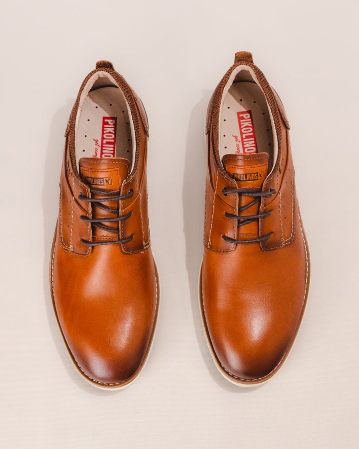 Top view showing breathable leather and textile blend with padded collar