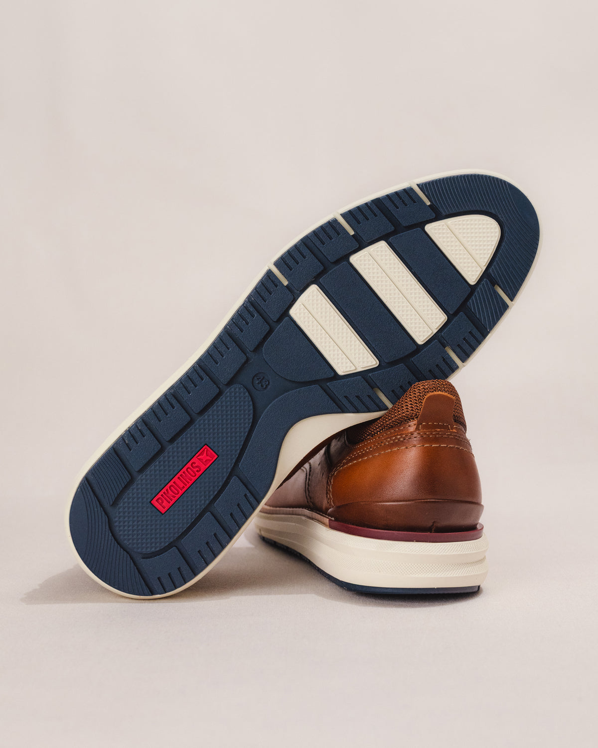 Bottom view of the Pikolinos MANACOR men’s sneaker in brown leather with slip-resistant outsole and pull-on heel tab