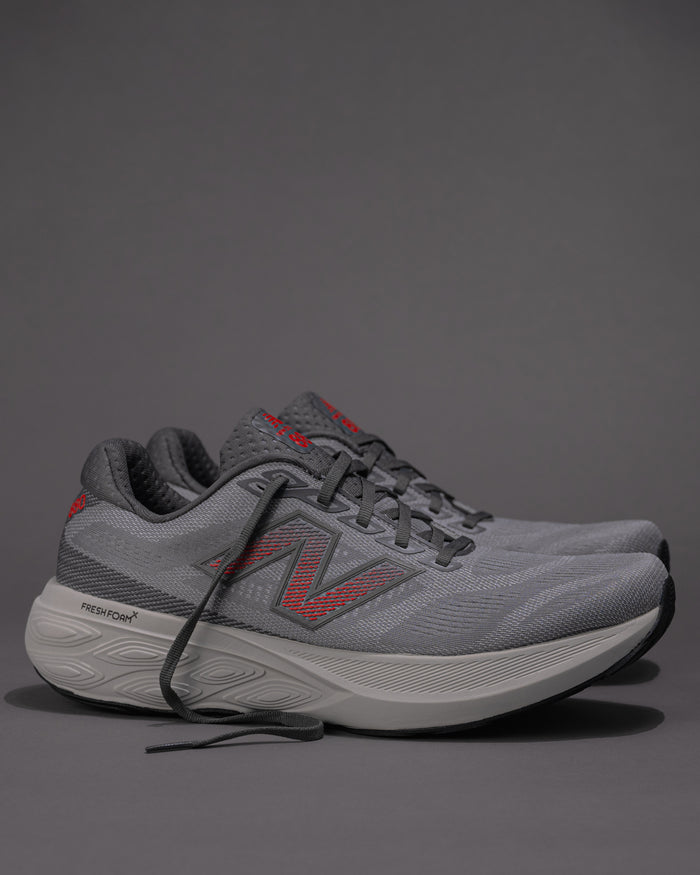Men's New Balance 880v15 running shoe side profile in gray and red colorway, showing Fresh Foam X midsole