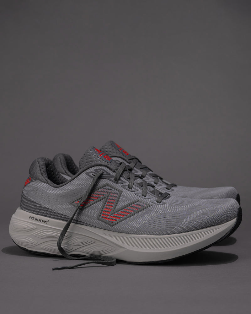 Men's New Balance 880v15 running shoe side profile in gray and red colorway, showing Fresh Foam X midsole
