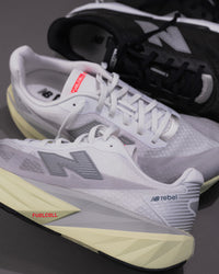 Men’s New Balance FuelCell Rebel v5 in Raincloud with Mineral and White – Lightweight Neutral Trainer side close up