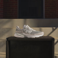 Side profile of New Balance 990 V6 Grey Suede, showing premium suede upper and mesh details