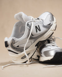 New Balance 530 Sneaker in Silver Metallic with Black Cement