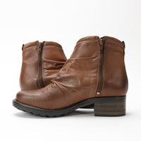 Taos Ravelle ankle bootie in soft leather with side zipper and ruched detail.