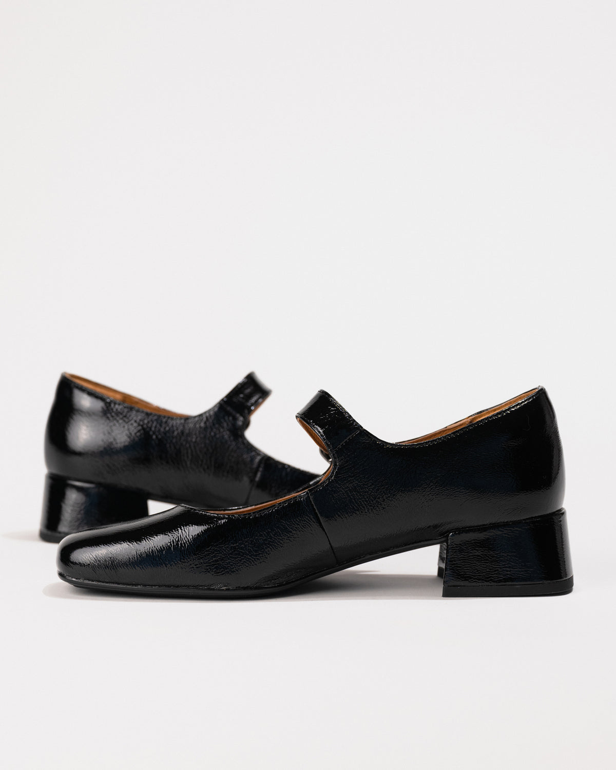 Side angle showcasing buckle strap and exterior silhouette.