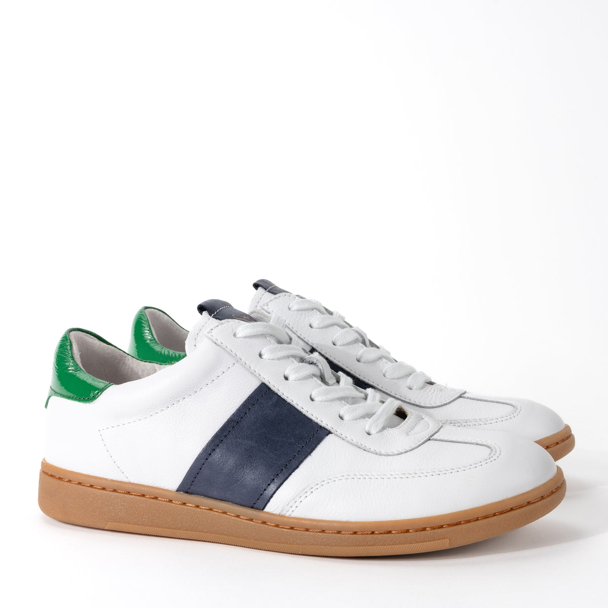 Side view of Sofft Ruby retro white leather sneaker, featuring Italian leather accents, and a lightweight, flexible rubber outsole.