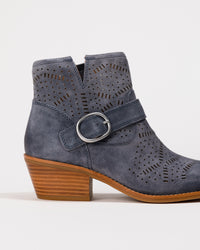 Blue laser-cut suede boot with a buckle on a white background