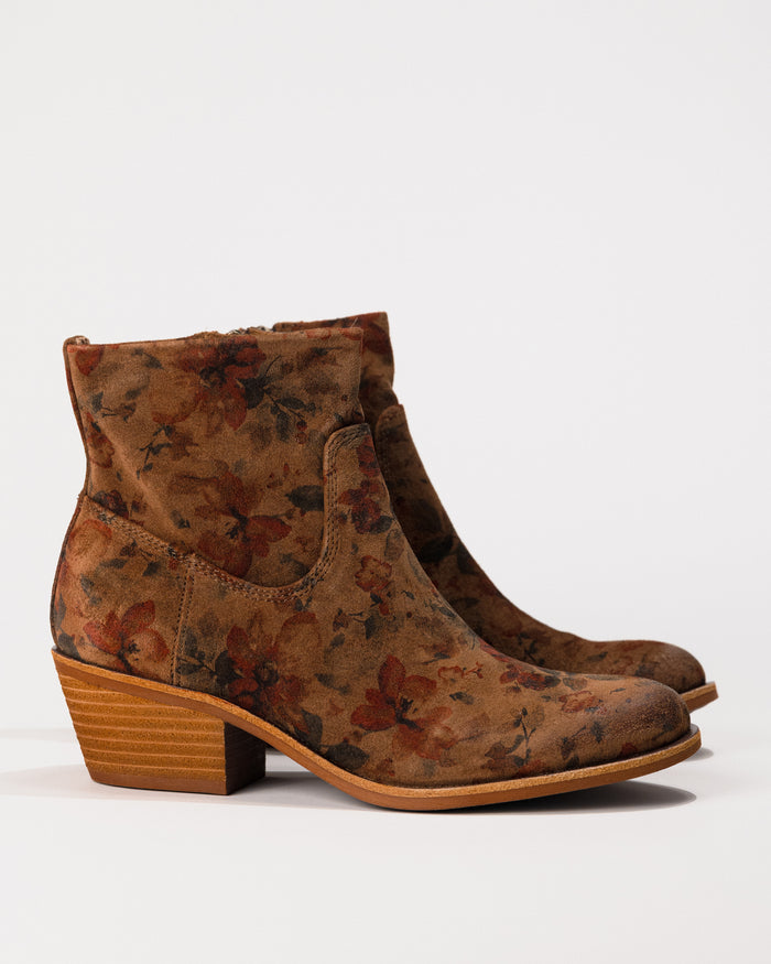 Profile of the Sofft April boot showing waterproof leather, almond toe, and stacked heel.