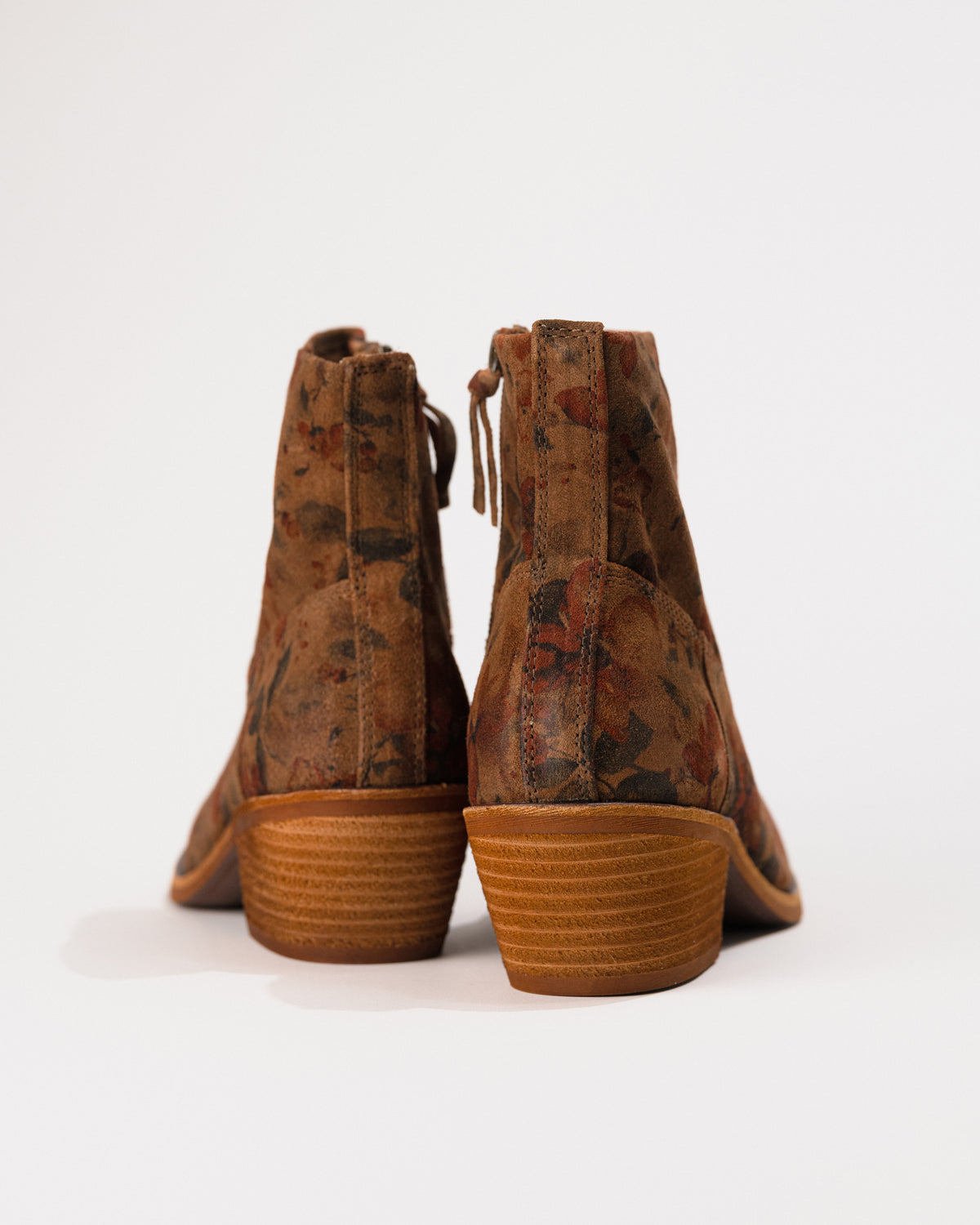 Focused image of stacked 2" heel with stitched welt.