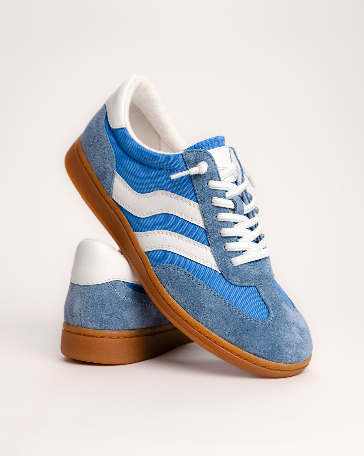 The Sofft Remmi is a fresh take on the classic retro runner, blending a vintage athletic silhouette with sophisticated, modern materials. Crafted from premium Italian suede with tonal nylon or fabric accents, this low-top sneaker features sporty contrast side stripes that give it an instant style refresh. It’s designed specifically for a lightweight feel, making it a go-to choice for transitioning your wardrobe into spring and summer.&nbsp;