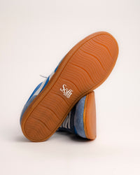 The Sofft Remmi in Blue is a fresh take on the classic retro runner, blending a vintage athletic silhouette with sophisticated, modern materials. Crafted from premium Italian suede with tonal nylon or fabric accents, this low-top sneaker features sporty contrast side stripes that give it an instant style refresh. It’s designed specifically for a lightweight feel, making it a go-to choice for transitioning your wardrobe into spring and summer.