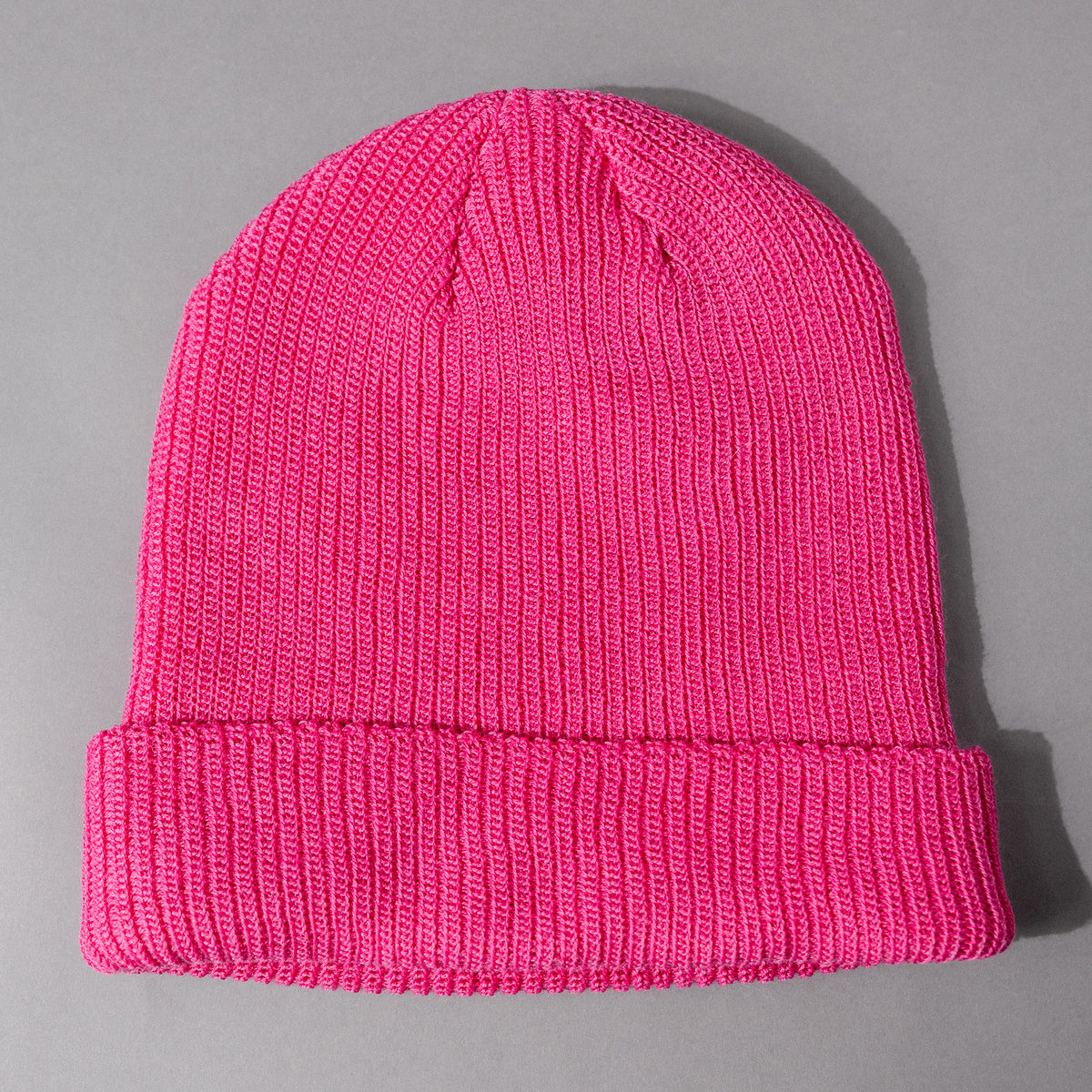 Overhead back view of the soft and cozy The Smartwool Beanie in Pink Merino Wool, a unisex woven beanie with Smartwool logo patch and fold-up rim.