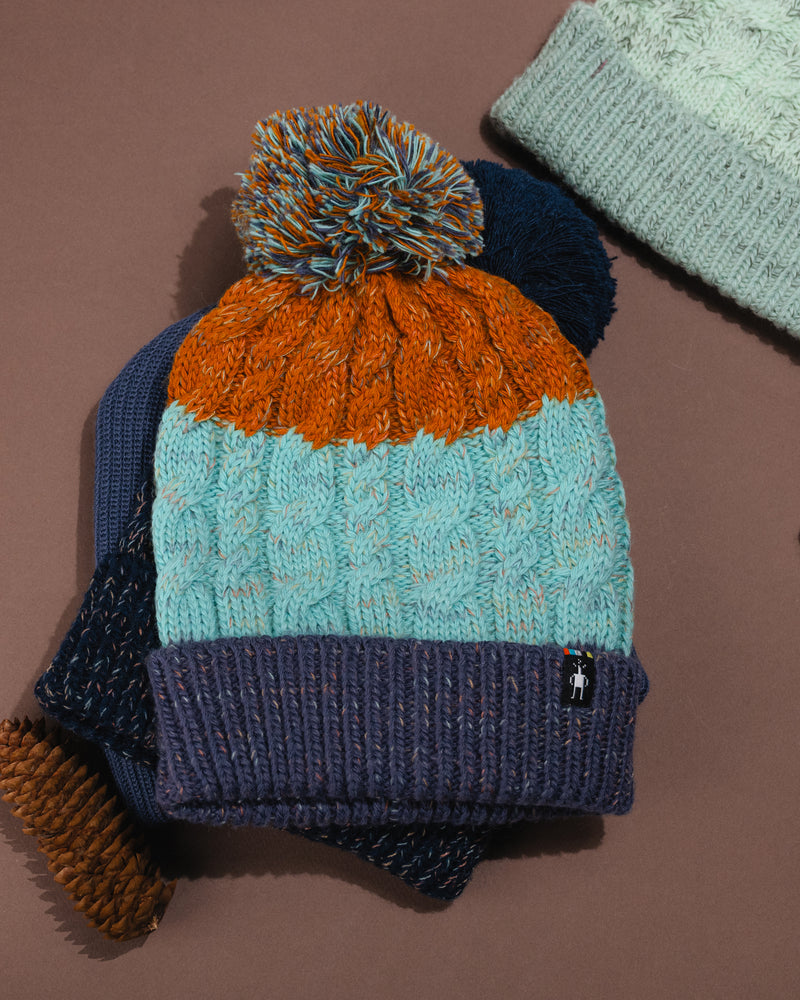 Front view of Smartwool Istro Retro Beanie showing knit texture and folded cuff