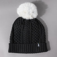 Front view of the Women's Smartwool Lodge Girl Soft Merino Knit Beanie with Faux Fur Pom in Black and Gray