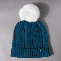 Overhead front detail view of the Women's Smartwool Lodge Girl Soft Merino Knit Beanie with Faux Fur Pom in Twilight