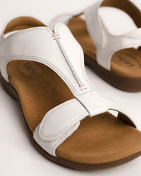 Women's Taos sandals. The Show comfort sandal features a premium white leather upper, adjustable straps, and a contoured cushioned footbed with arch support for all-day wear.