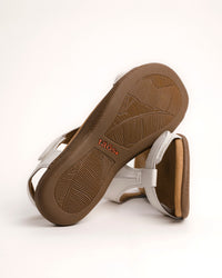 Women's Taos sandals. The Show comfort sandal features a premium white leather upper, adjustable straps, and a contoured cushioned footbed with arch support for all-day wear.