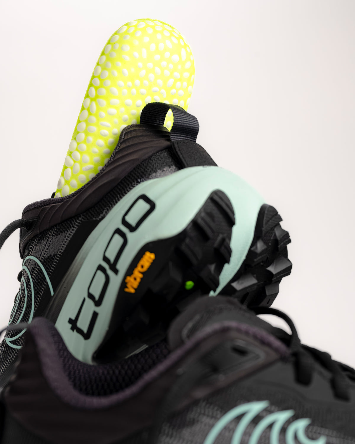 The Topo Vista is built for those who want to take on technical, rugged terrain without feeling the sting of the trail. As Topo’s premier max-cushion trail model, it features a high-stack 38mm x 33mm platform that provides a massive amount of underfoot protection. The rockered midsole design works in tandem with the plush ZipFoam™ compound to create a smooth, rolling transition that saves your legs during long-distance efforts and steep descents.