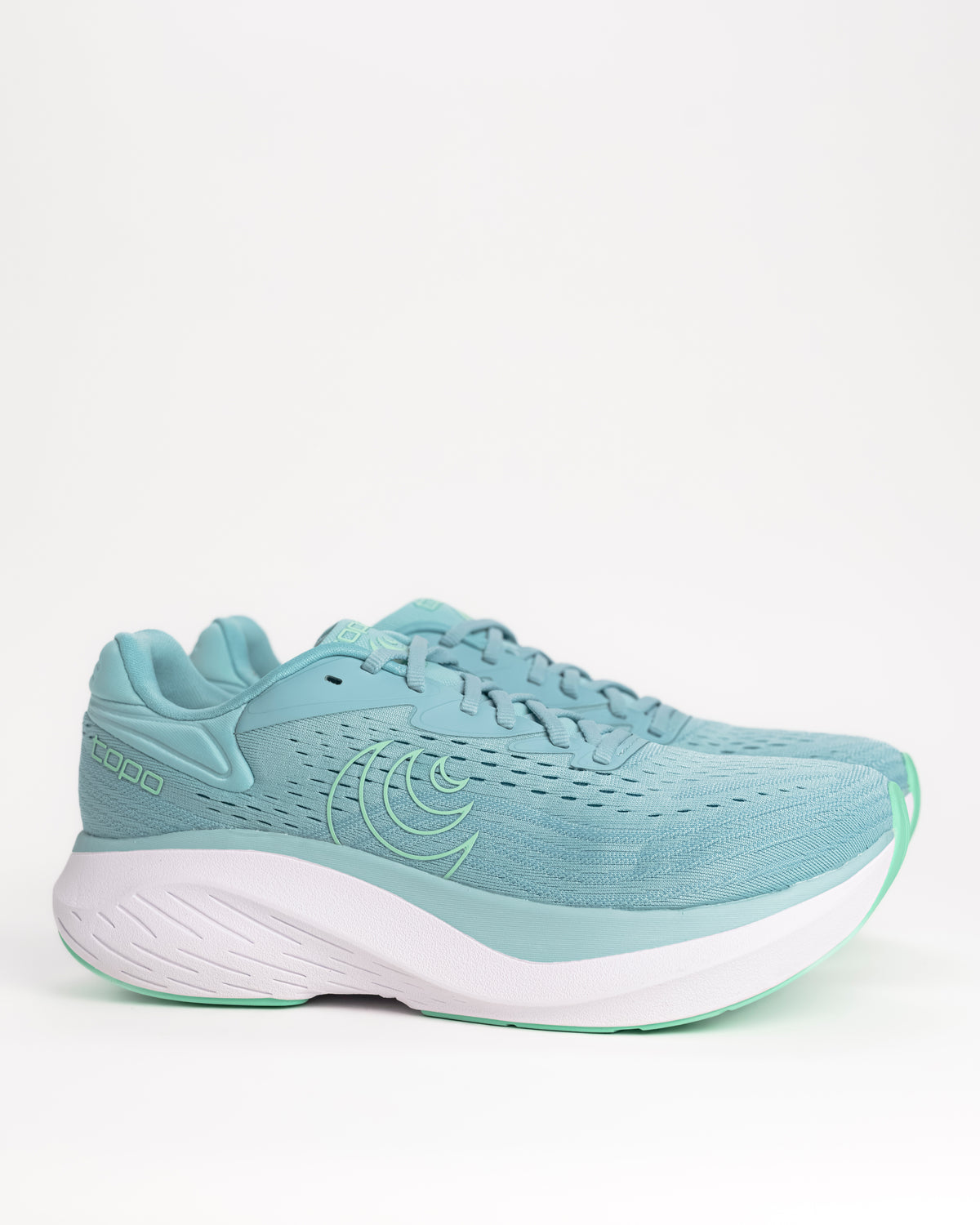 The Women's Topo Atmos 2 in Aqua/Mint is the softest ride in the Topo lineup, built for those high-mileage days where comfort is the only thing that matters. This second-generation model features an even deeper bed of upgraded ZipFoam™, providing a plush, energetic feel that doesn't pack out over time. While many max-cushion shoes can feel clunky, the Atmos 2 uses a refined rocker geometry to keep your stride feeling smooth and fluid from heel-strike to toe-off.