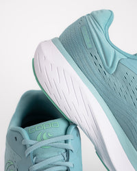 Midsole detail on the Women's Topo Atmos 2 in Aqua/Mint. It is the softest ride in the Topo lineup, built for those high-mileage days where comfort is the only thing that matters. This second-generation model features an even deeper bed of upgraded ZipFoam™, providing a plush, energetic feel that doesn't pack out over time. While many max-cushion shoes can feel clunky, the Atmos 2 uses a refined rocker geometry to keep your stride feeling smooth and fluid from heel-strike to toe-off.