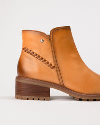 Close-up of the block heel and shaft contour detailing on the Medina boot.