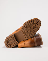 Outsole view displaying the tread and synthetic sole for grip and durability.