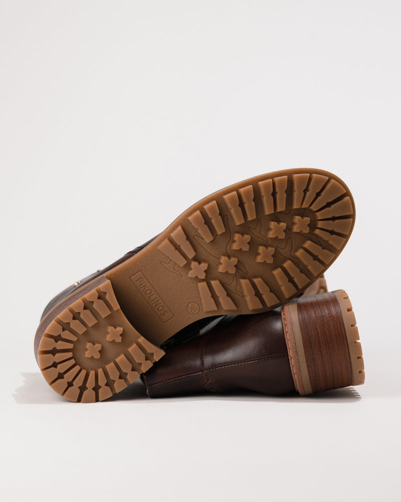 Outsole view displaying the tread and synthetic sole for grip and durability.