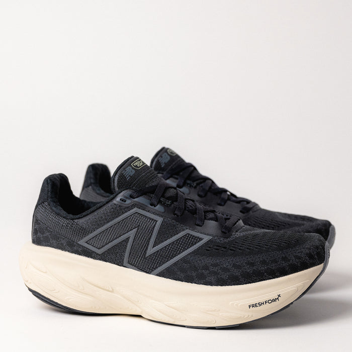  Front angle of Women's New Balance Fresh Foam X 1080 V14 in Black/Sea Salt, showcasing the triple jacquard mesh upper and sleek silhouette.