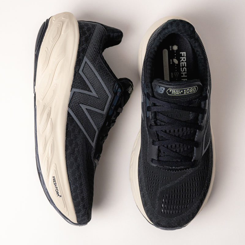 Side view of the New Balance Fresh Foam X 1080 V14 in Black/Sea Salt, highlighting the rocker profile and Fresh Foam X cushioning.