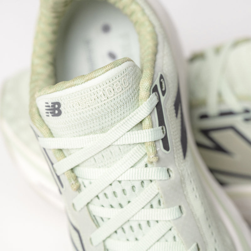 Detailed shot of the triple jacquard mesh upper and lace-up design, showcasing its breathable and lightweight construction.