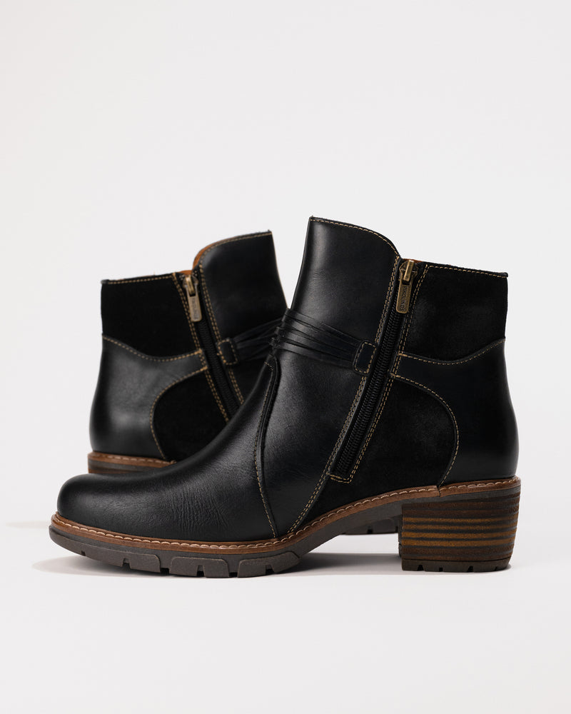 Side shot displaying the inner ankle and easy-on zipper entry.
