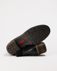 Bottom view of the durable synthetic sole with tread pattern for traction.