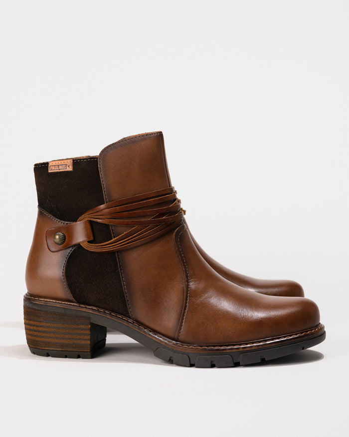 Full profile of the San Sebastian Boot in Topo/Brown calfskin leather with visible block heel.