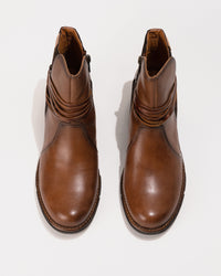 Top-down view highlighting the subtle round toe shape and curved shaft opening.