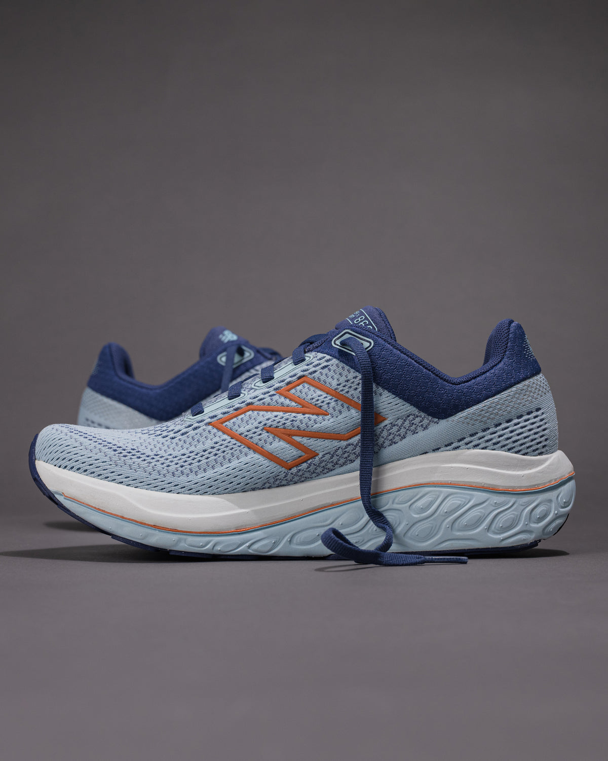 Blue and orange running shoes on a gray background Women's New Balance Fresh Foam X 860 v14 Stability Shoe in Frost