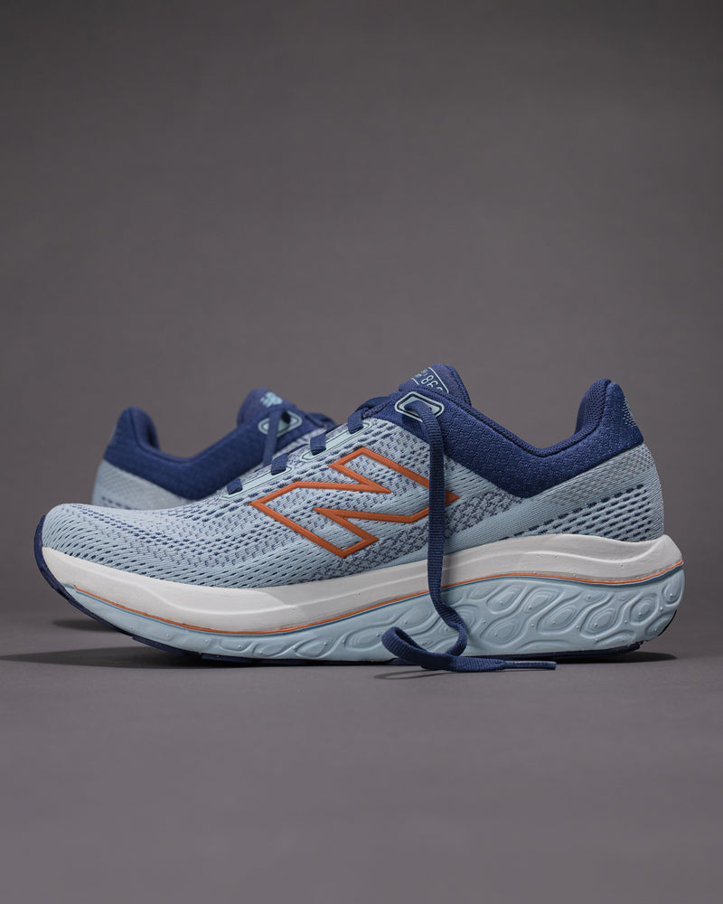 Blue and orange running shoes on a gray background Women's New Balance Fresh Foam X 860 v14 Stability Shoe in Frost