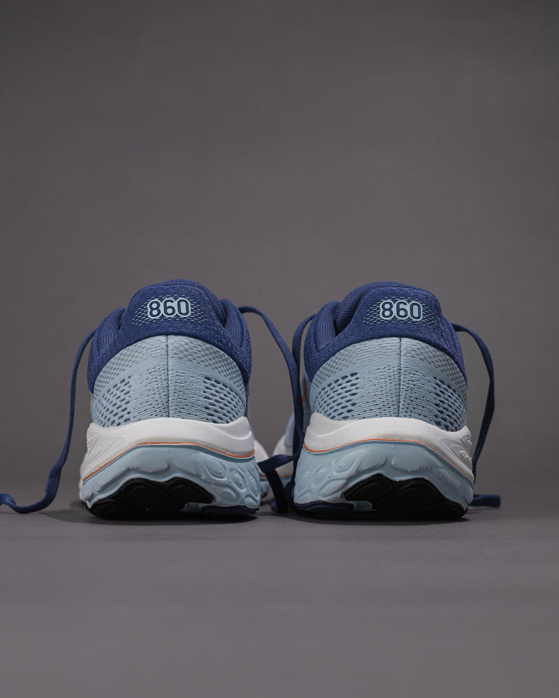 Blue running shoes with '860' branding on a gray background Women's New Balance Fresh Foam X 860 v14 Stability Shoe in Frost