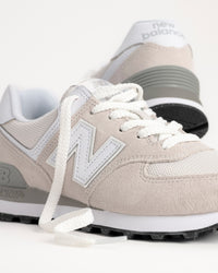 Close-up of suede and mesh upper and "N" applique detail on New Balance 574