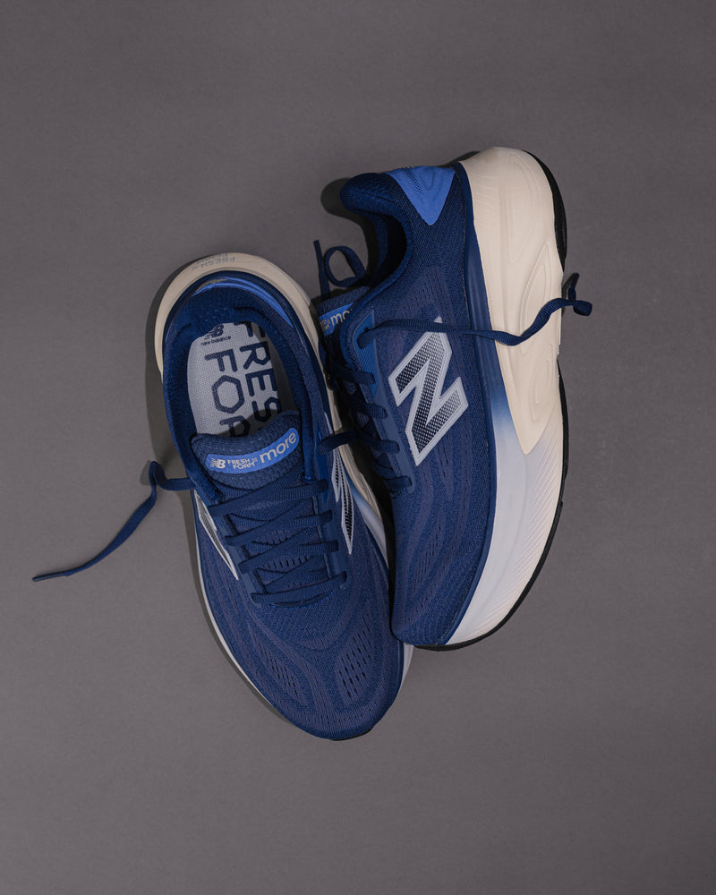 Angled view highlighting the midsole geometry and mesh upper in Blue.