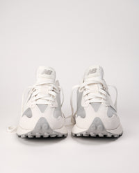 Front view of the New Balance 327 in metallic showing trail-inspired outsole and nylon tongue